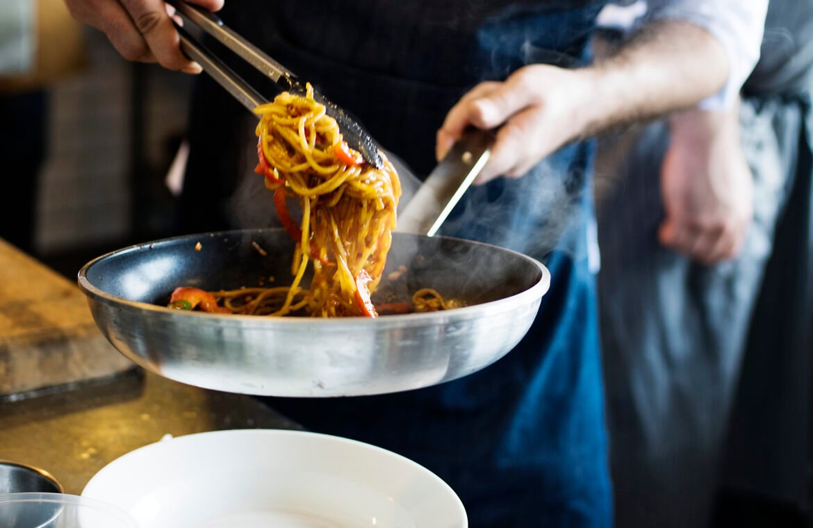 chef cooking spaghetti kitchen